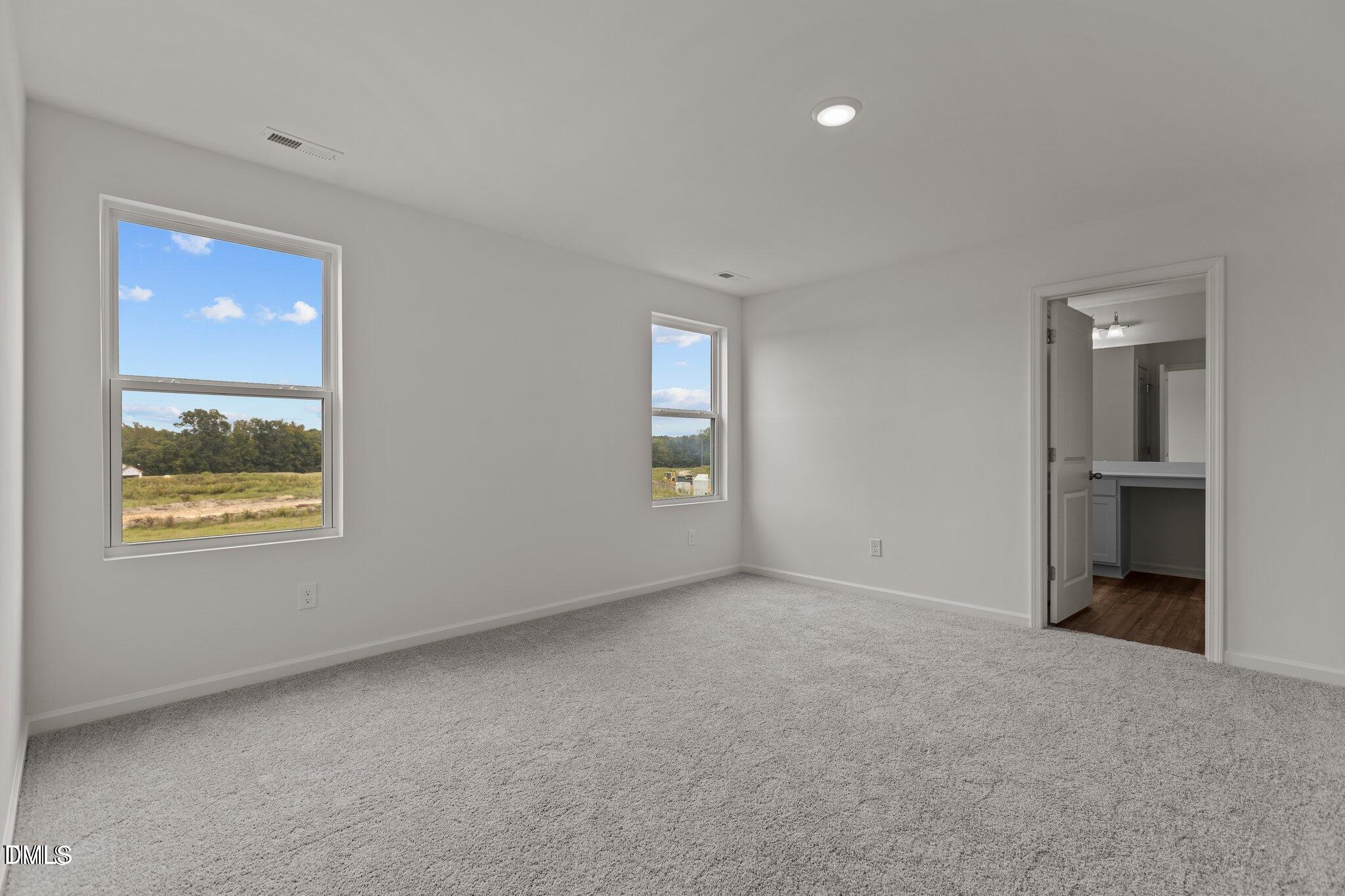 149 Bedstone Way Clayton, NC 27520 - Photo 9 of 22 a view of an empty room with a window