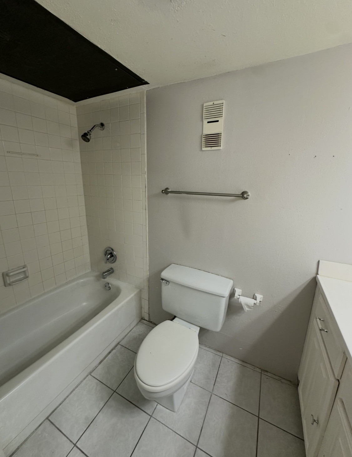 16120 Stuebner Airline Road, Unit 202 Spring, TX 77379 - Photo 10 of 12 a white toilet and tub sitting next to a bathroom sink