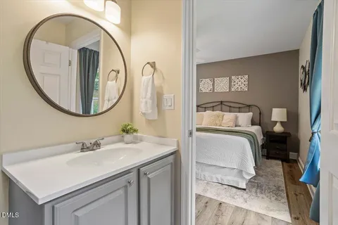 a en suite bathroom with a sink and a mirror