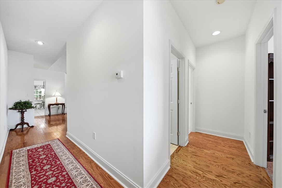 112 Elliott Circle Anderson, SC 29621 - Photo 14 of 35 Hardwood floors and recessed lighting enhance this well-lit interior hallway.