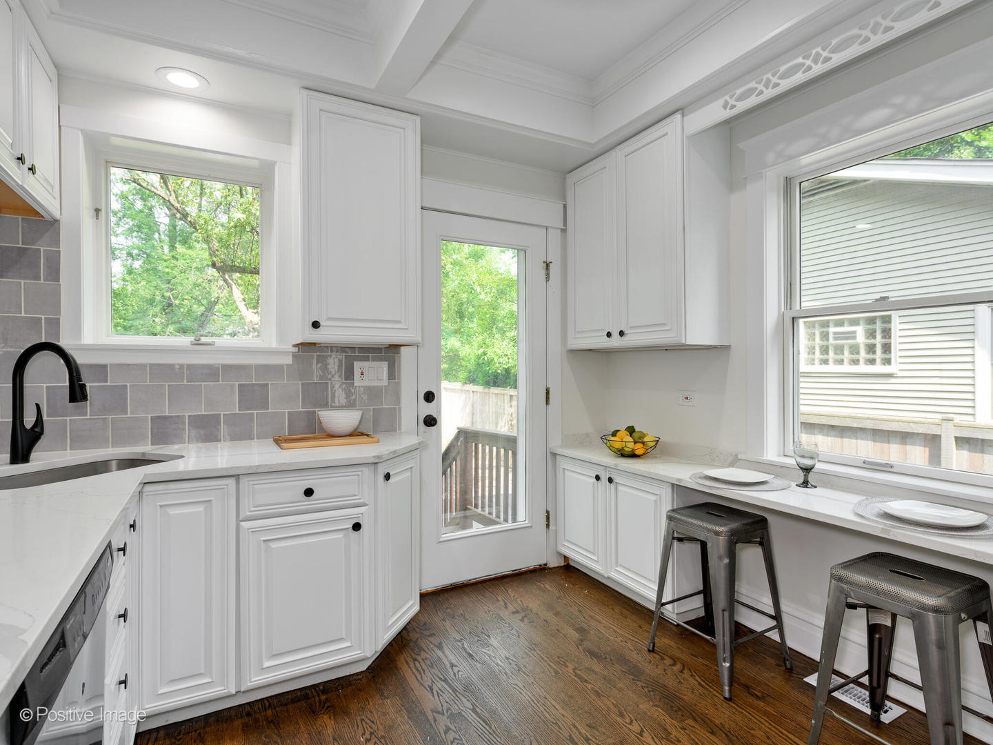 1137 Willow Road Winnetka, IL 60093 - Photo 11 of 31 a kitchen with a sink a window and cabinets