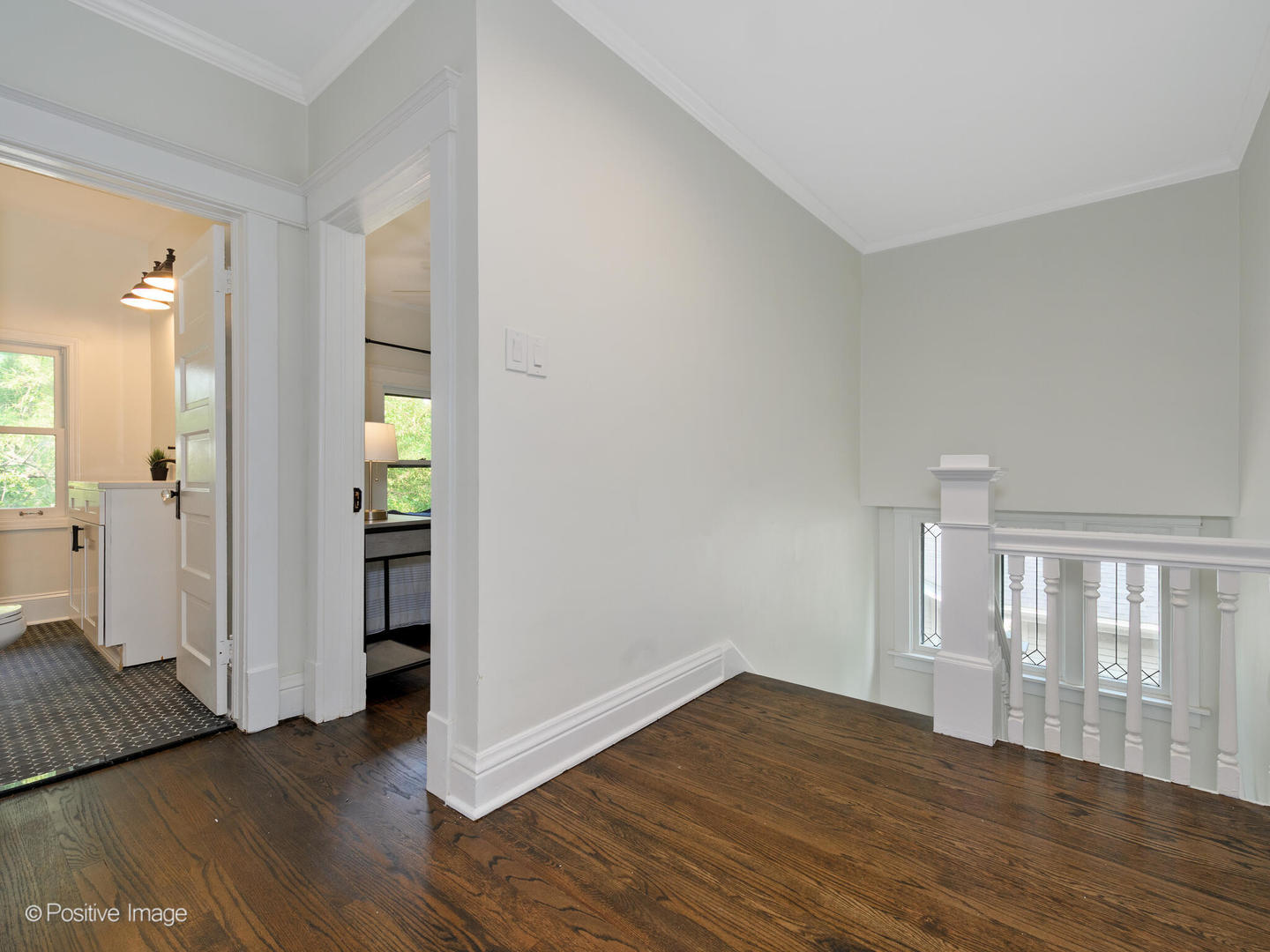 1137 Willow Road Winnetka, IL 60093 - Photo 14 of 31 wooden floor in an empty room with a window