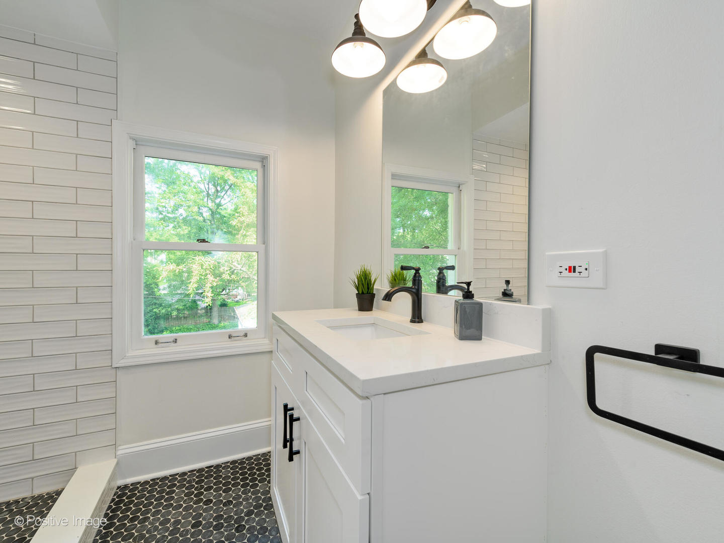 1137 Willow Road Winnetka, IL 60093 - Photo 17 of 31 a bathroom with a sink a toilet and a mirror
