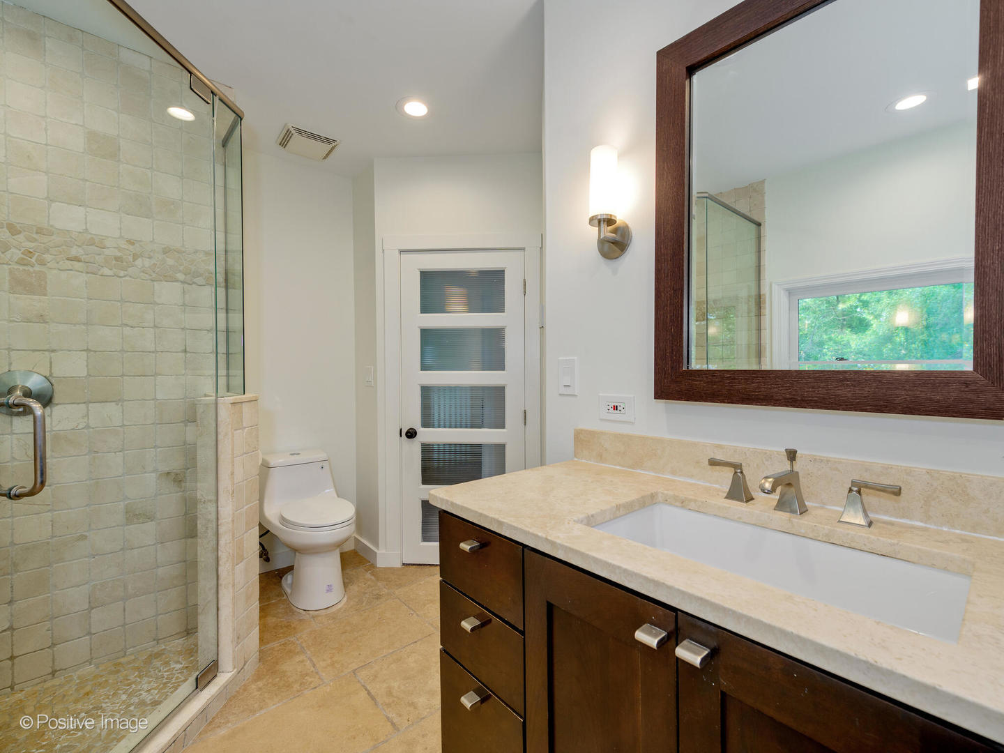 1137 Willow Road Winnetka, IL 60093 - Photo 21 of 31 a bathroom with a granite countertop sink a toilet and a mirror