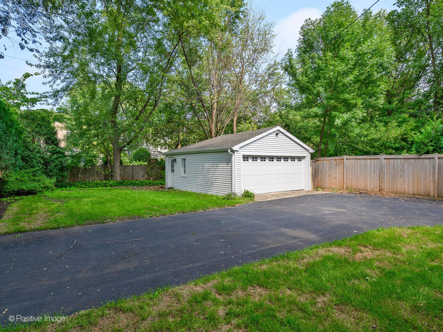 1137 Willow Road Winnetka, IL 60093 - Photo 27 of 31 a view of a house with a yard and a large tree