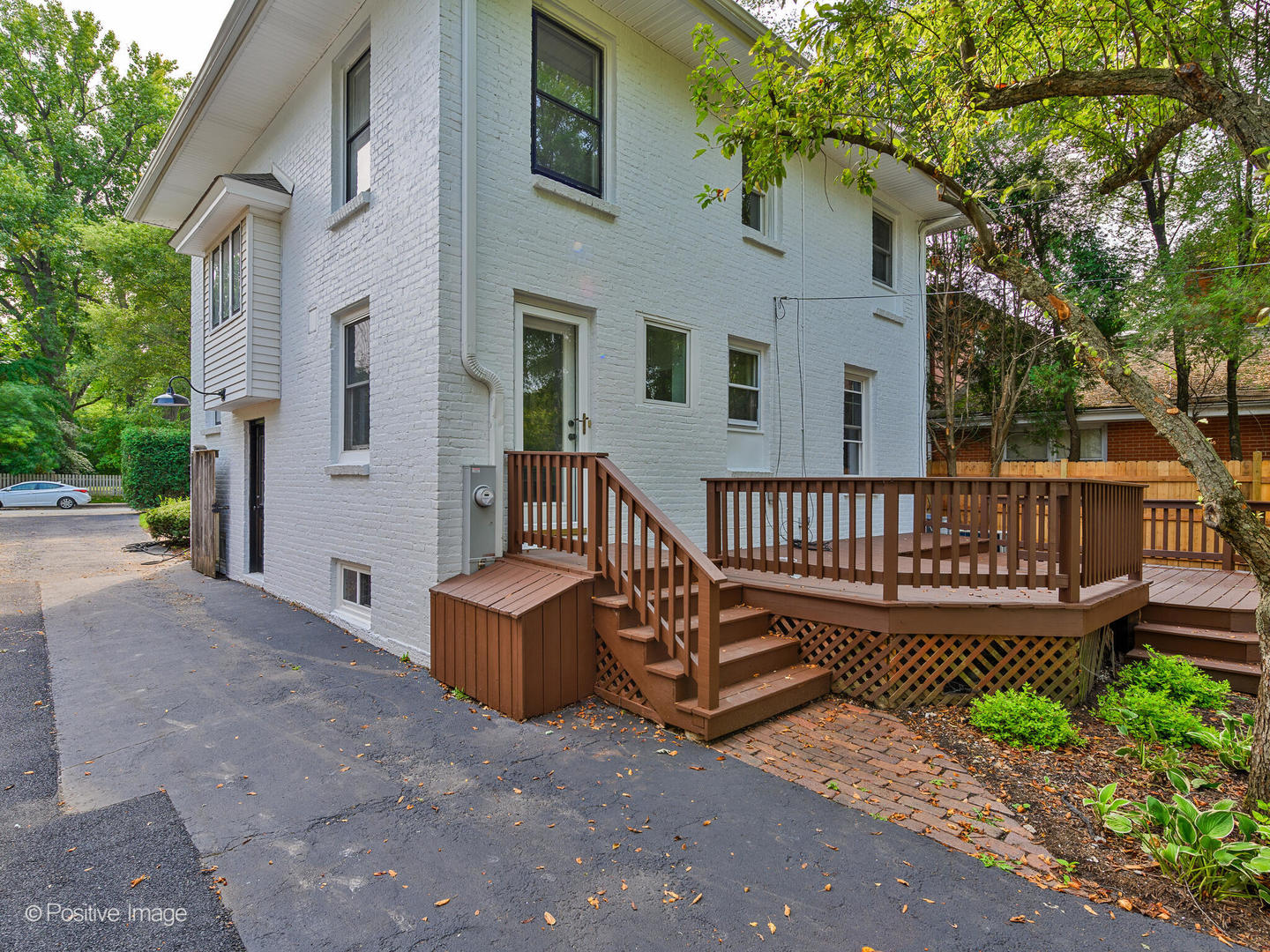 1137 Willow Road Winnetka, IL 60093 - Photo 29 of 31 a view of a house with wooden deck and furniture