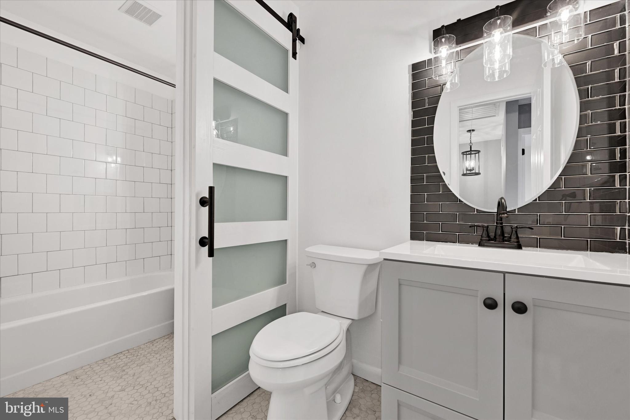 21 Allison Way Abingdon, MD 21009 - Photo 13 of 26 a bathroom with a toilet a sink and bathtub