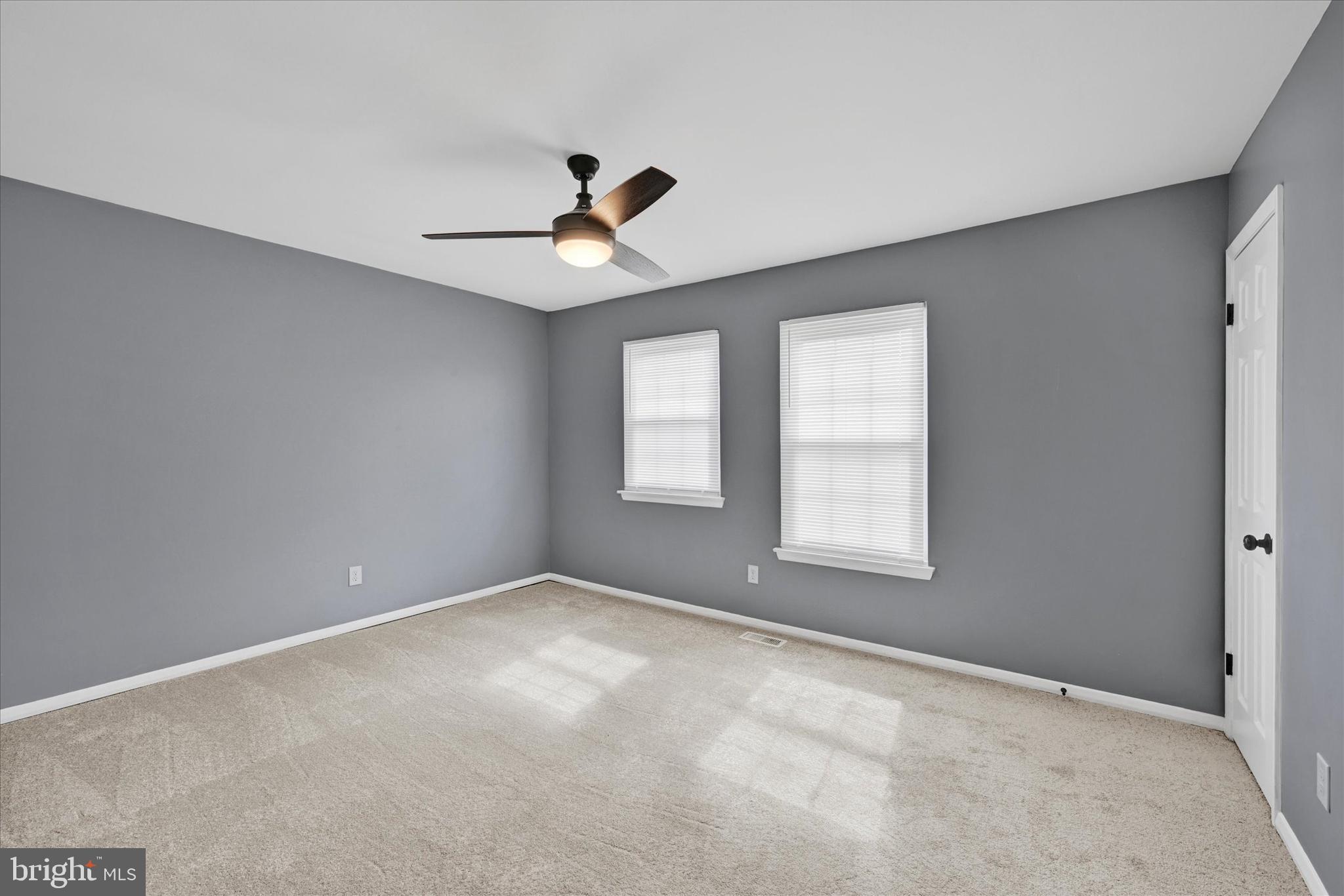 21 Allison Way Abingdon, MD 21009 - Photo 14 of 26 a view of a big room with windows and chandelier fan