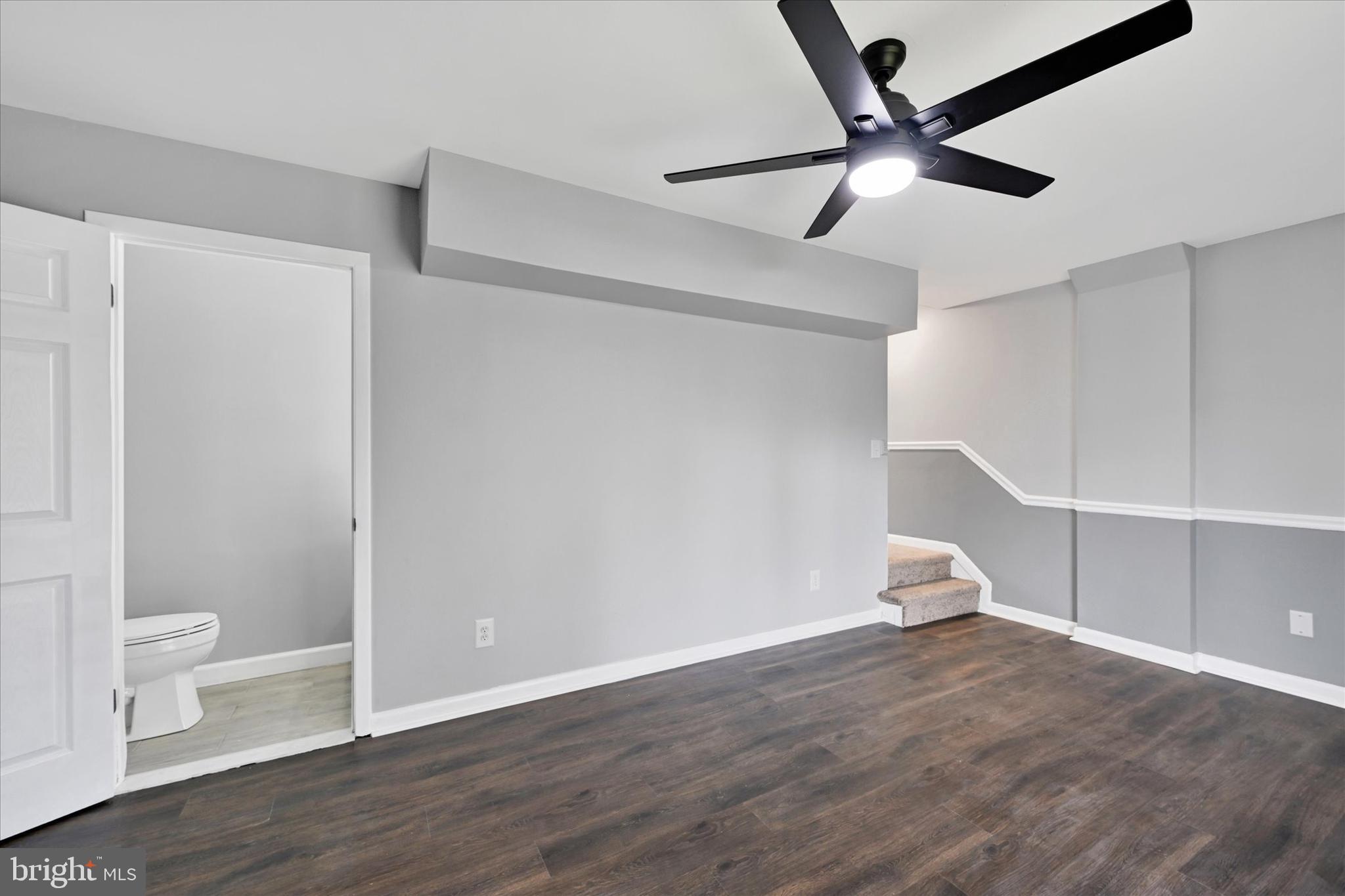 21 Allison Way Abingdon, MD 21009 - Photo 21 of 26 a view of an empty room with a window and wooden floor