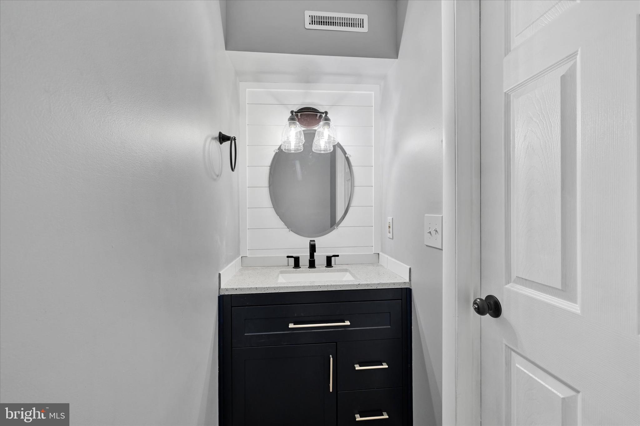 21 Allison Way Abingdon, MD 21009 - Photo 22 of 26 a bathroom with a sink and a mirror