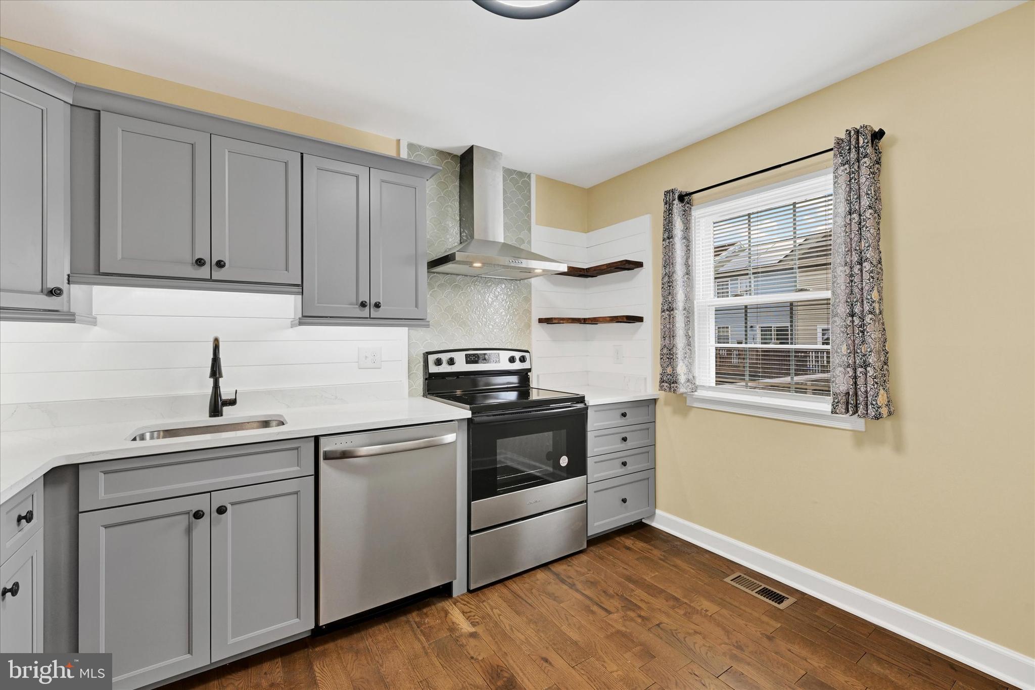 21 Allison Way Abingdon, MD 21009 - Photo 5 of 26 a kitchen with cabinets stainless steel appliances and sink