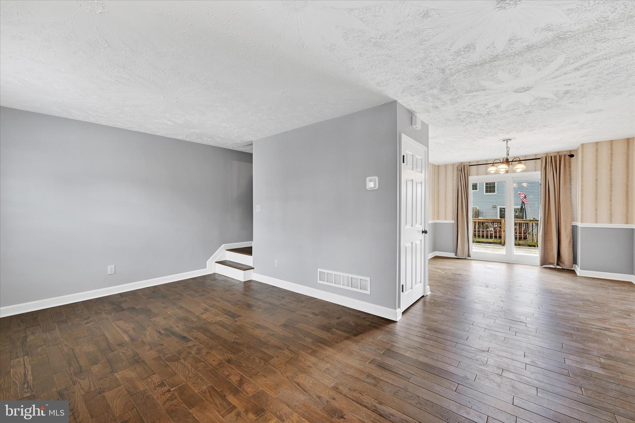21 Allison Way Abingdon, MD 21009 - Photo 9 of 26 a view of an empty room with wooden floor and a window