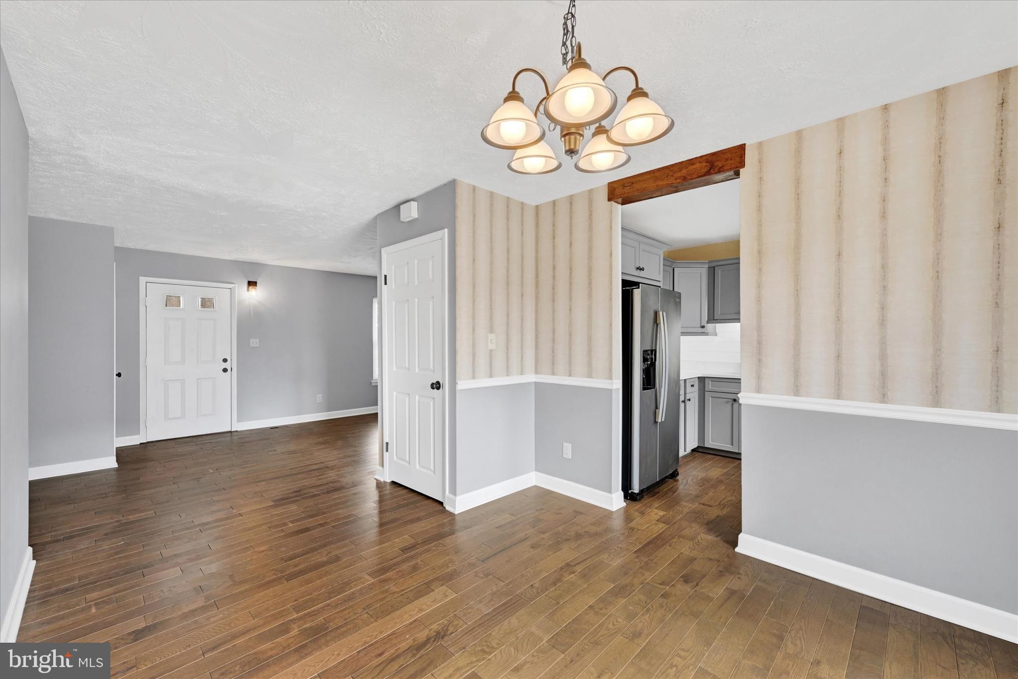 21 Allison Way Abingdon, MD 21009 - Photo 10 of 26 a view of an empty room with wooden floor