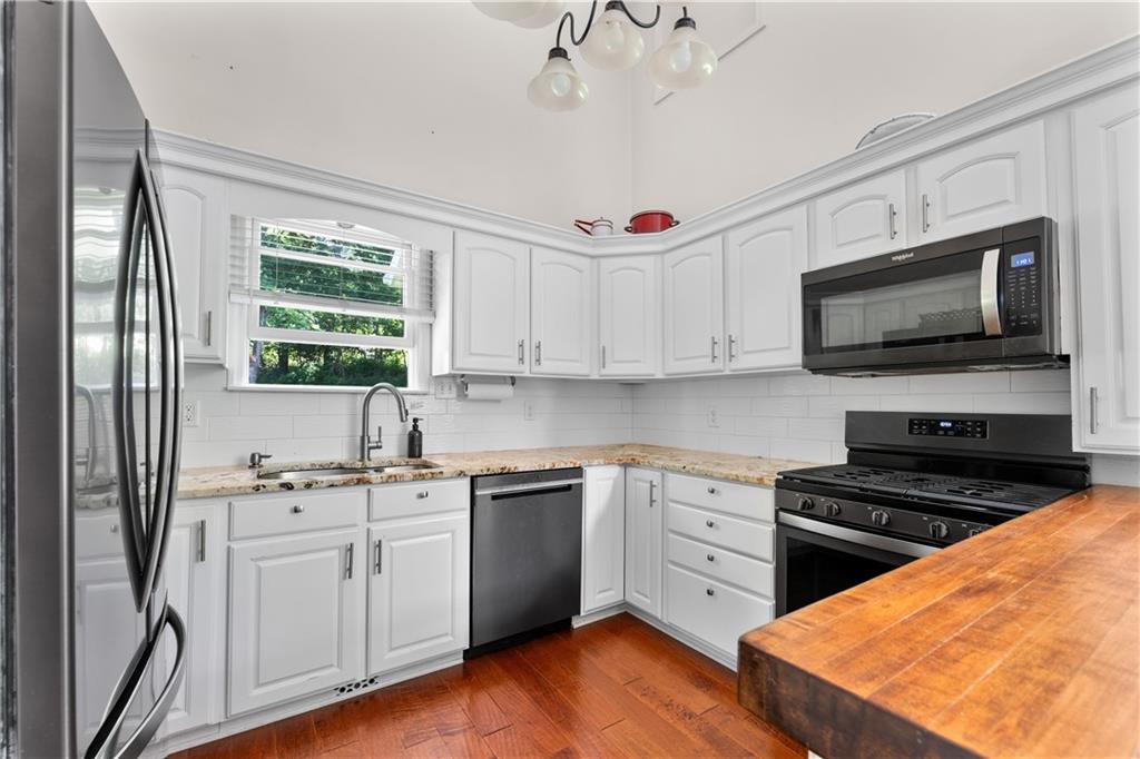 147 Lindley Road Canonsburg, PA 15317 - Photo 15 of 35 Kitchen boasts granite counter tops and a butcher block peninsula.