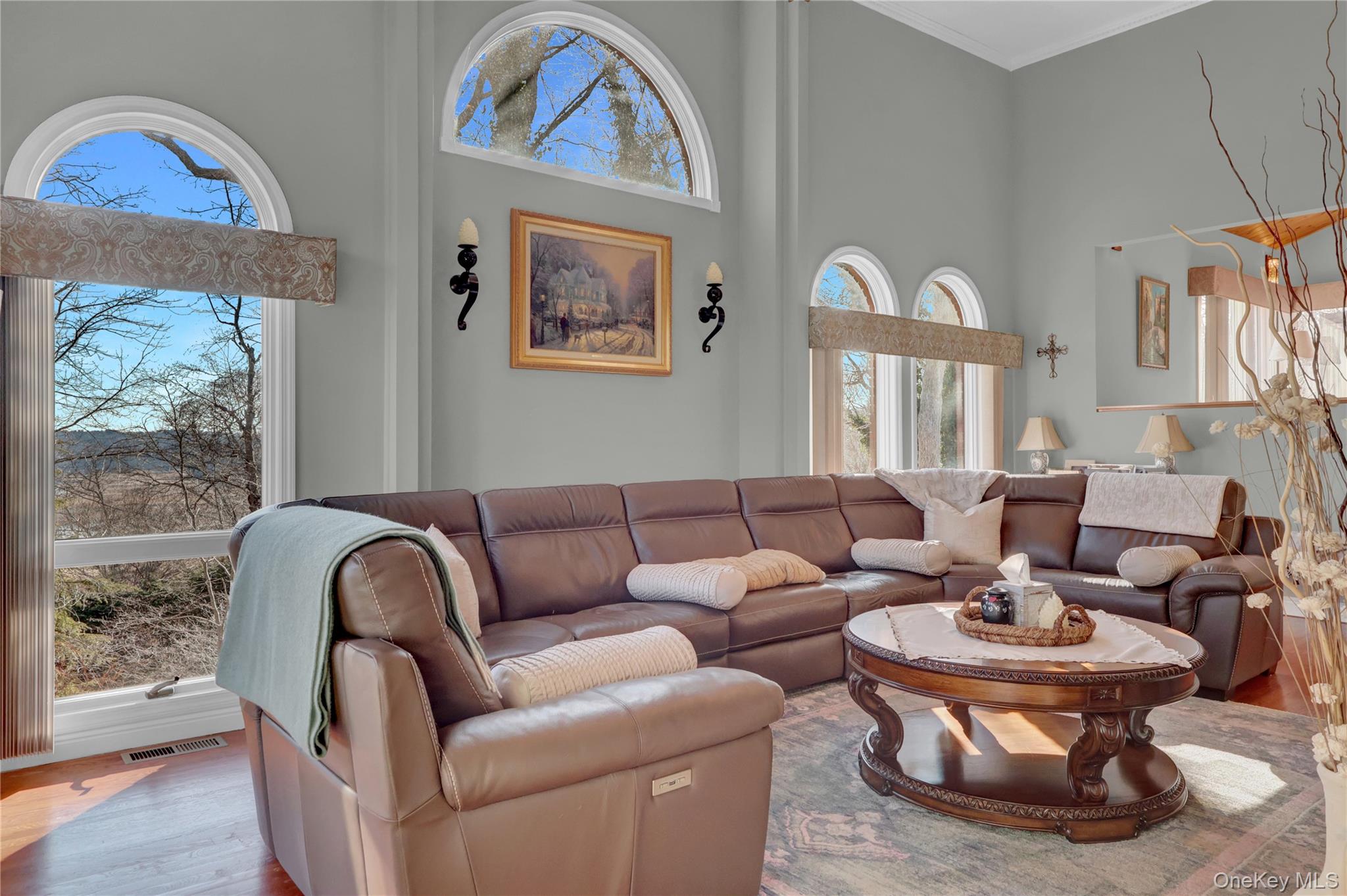 2 Riverview Terrace Smithtown, NY 11787 - Photo 18 of 48 a living room with furniture a large window and a chandelier