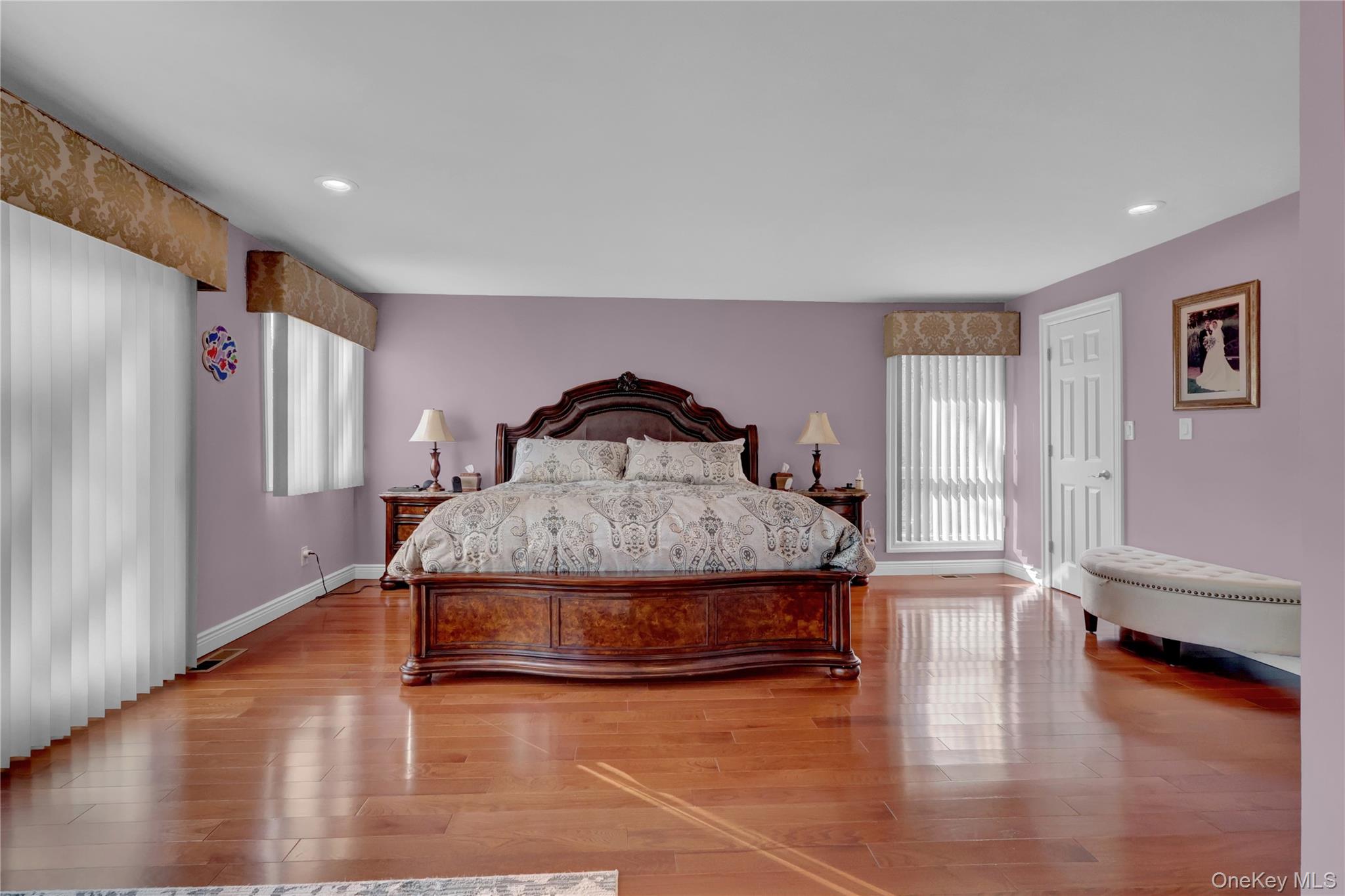 2 Riverview Terrace Smithtown, NY 11787 - Photo 19 of 48 a bedroom with a bed and wooden floor