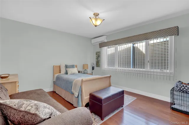 a bedroom with a bed and a chair