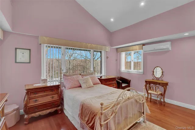 a bathroom with a sink a toilet a mirror and shower