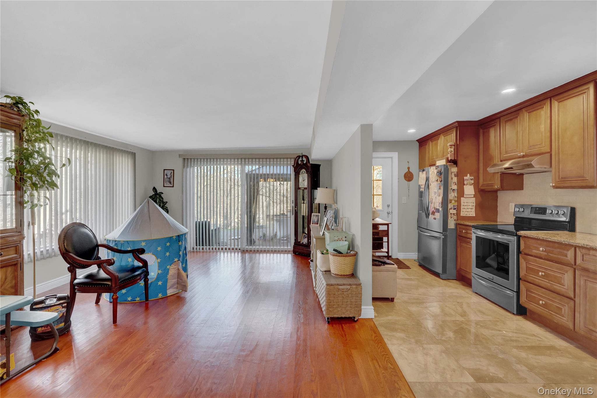 2 Riverview Terrace Smithtown, NY 11787 - Photo 29 of 48 a living room with furniture stove and wooden floor