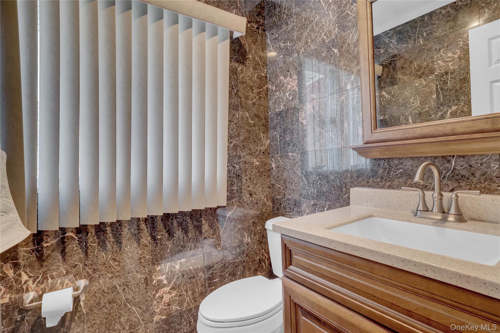 2 Riverview Terrace Smithtown, NY 11787 - Photo 32 of 48 a bathroom with a toilet and a sink