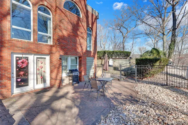 a front view of a house with garden and porch