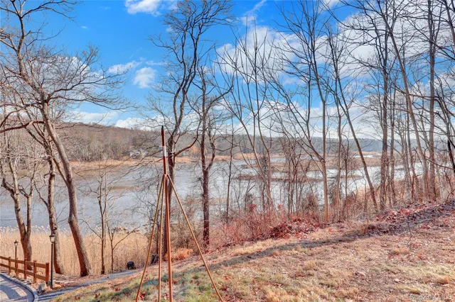 a view of a house with snow on the road
