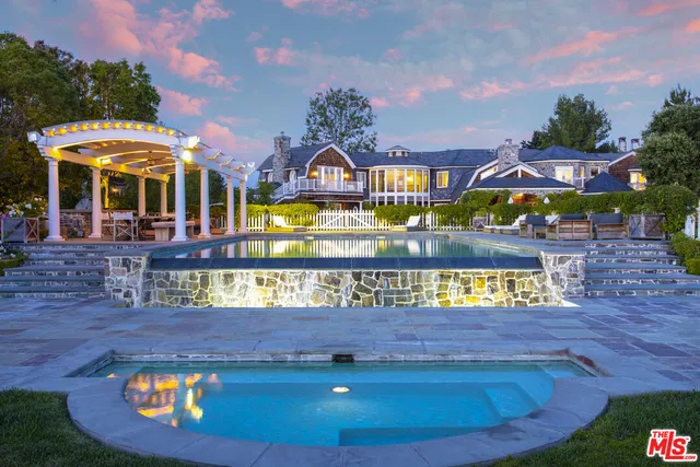 a view of swimming pool with outdoor seating