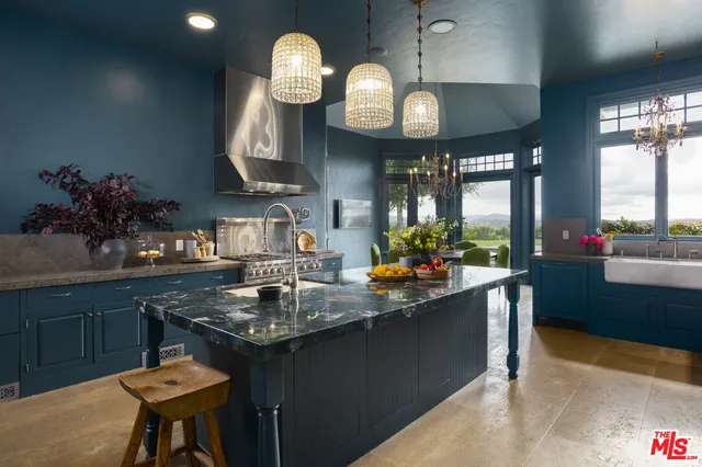a kitchen with counter space cabinets and appliances