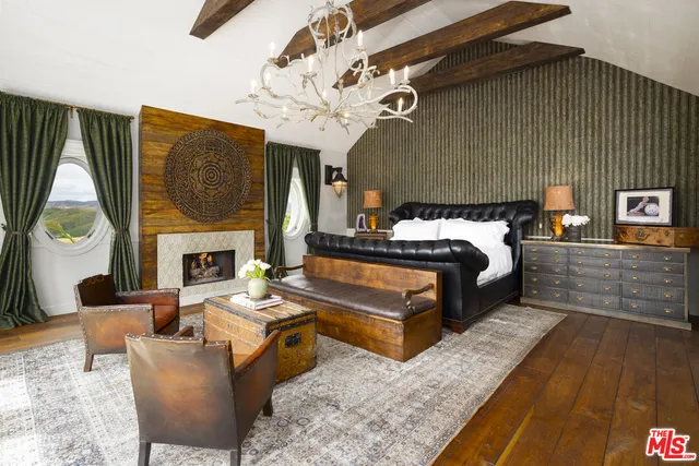 a spacious bathroom with a double vanity sink a mirror and a bathtub