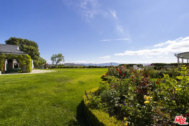 a view of swimming pool with an outdoor seating