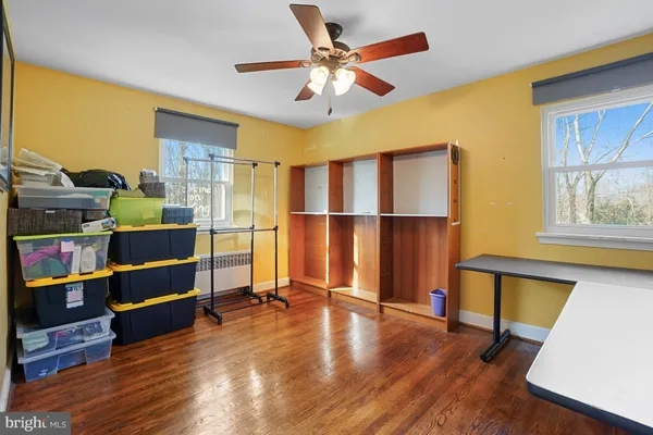 a view of room with furniture and wooden floor