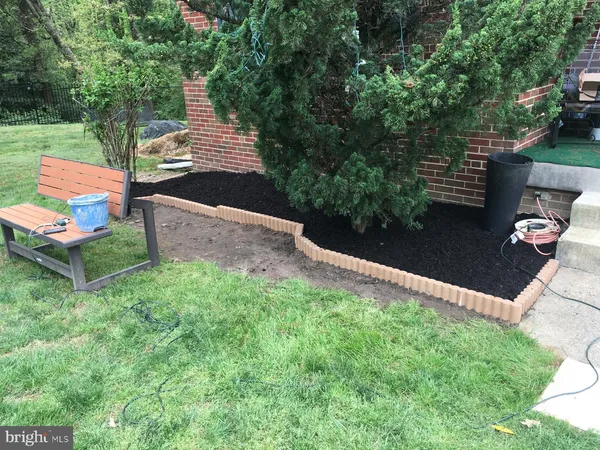 a view of a backyard with sitting area
