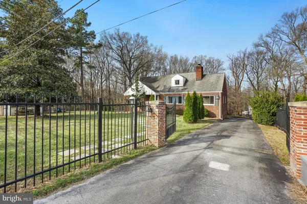a view of a park with iron fence