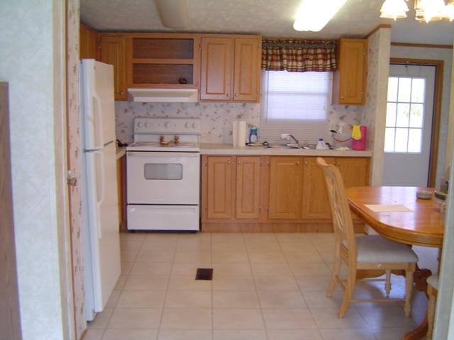 118 Spence Road Union Hall, VA 24176 - Photo 3 of 6 a kitchen with a stove a sink and a refrigerator