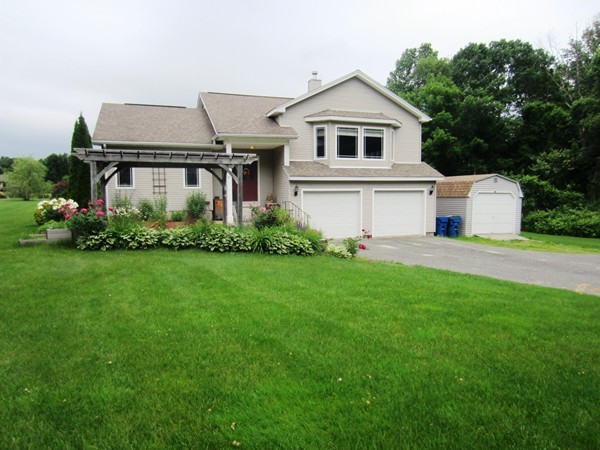 81 Osborne Road Ware, MA 01082 - Photo 1 of 26 a front view of a house with a garden and plants