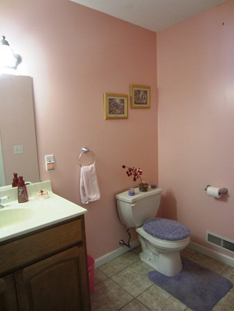 81 Osborne Road Ware, MA 01082 - Photo 17 of 26 a bathroom with a toilet sink and mirror