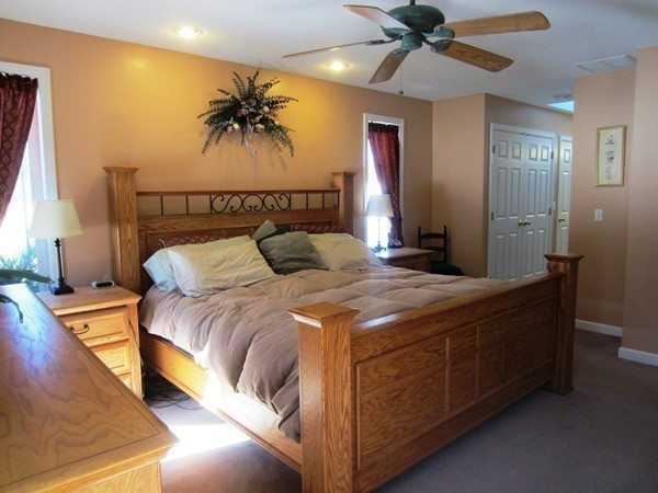 81 Osborne Road Ware, MA 01082 - Photo 18 of 26 a bedroom with a bed and a chandelier