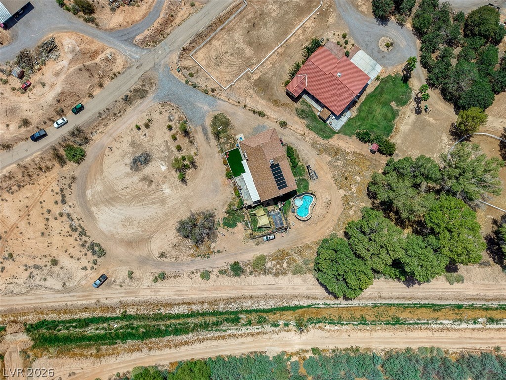 1920 Bowman Road Logandale, NV 89021 - Photo 68 of 68 A high-altitude perspective showcases the sprawling property layout, private pool, and surrounding rural desert landscape.