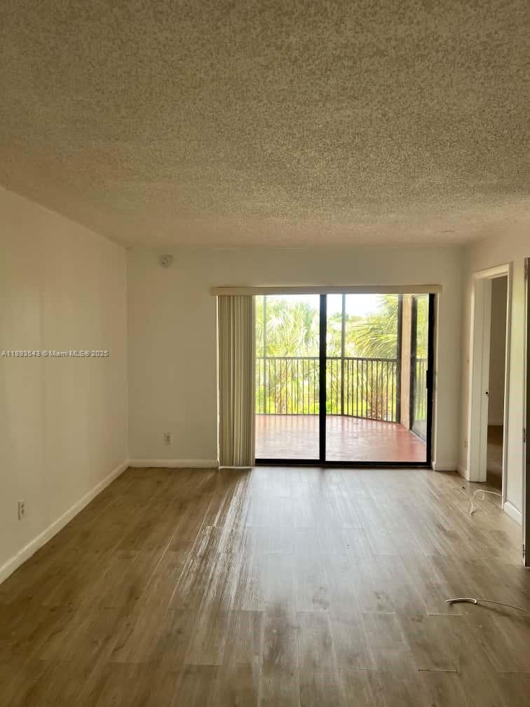3470 Foxcroft Road, Unit 307 Miramar, FL 33025 - Photo 3 of 12 a view of an empty room with a window