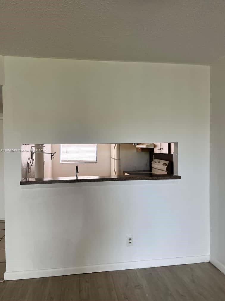 3470 Foxcroft Road, Unit 307 Miramar, FL 33025 - Photo 5 of 12 a close view of cabinet with granite countertop