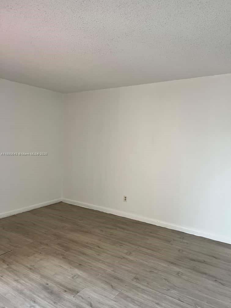 3470 Foxcroft Road, Unit 307 Miramar, FL 33025 - Photo 8 of 12 wooden floor in a room