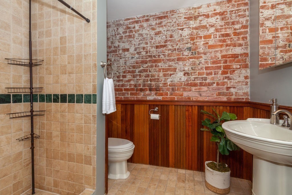 797 Columbia Road, Unit 3 Boston, MA 02125 - Photo 13 of 18 a bathroom with a sink and a toilet