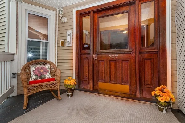 a room with lounge chair and a window