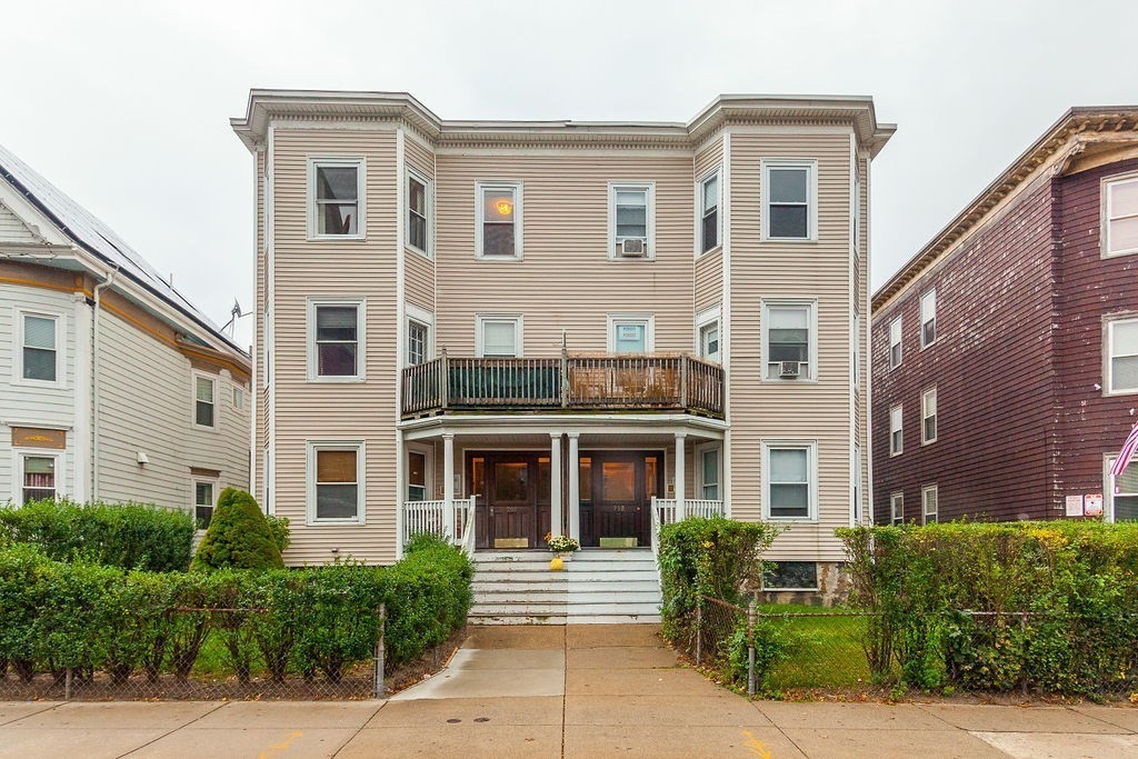 797 Columbia Road, Unit 3 Boston, MA 02125 - Photo 17 of 18 a front view of a house with a yard