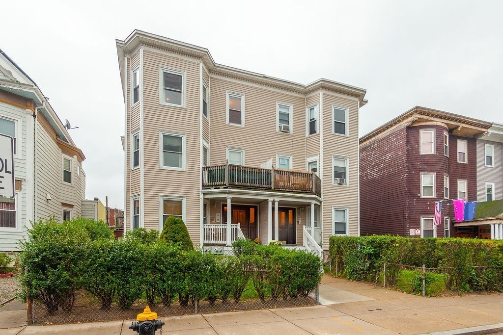 797 Columbia Road, Unit 3 Boston, MA 02125 - Photo 18 of 18 a view of a building with a yard and plants