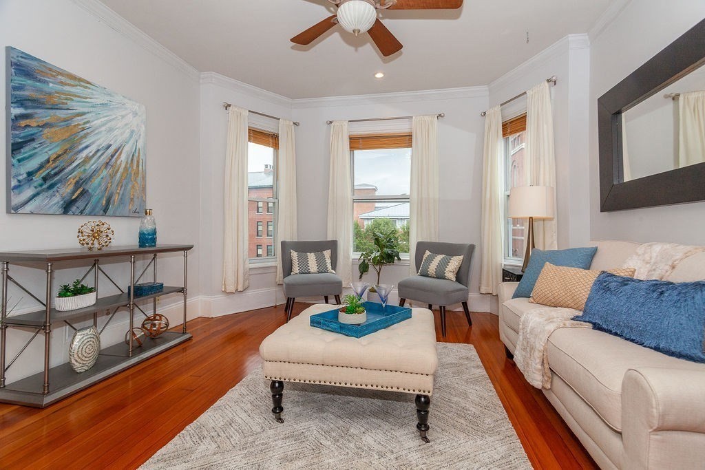 797 Columbia Road, Unit 3 Boston, MA 02125 - Photo 4 of 18 a living room with furniture and a large window