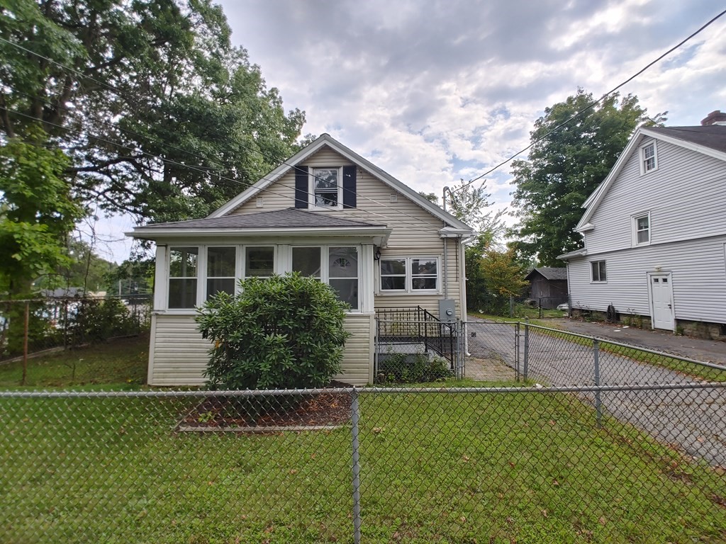 23 Eldert Street Springfield, MA 01109 - Photo 1 of 14 a front view of a house with a yard