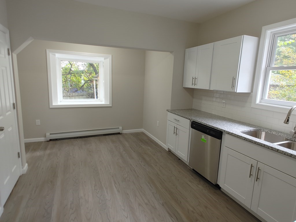23 Eldert Street Springfield, MA 01109 - Photo 4 of 14 a kitchen with a sink wooden floor and window