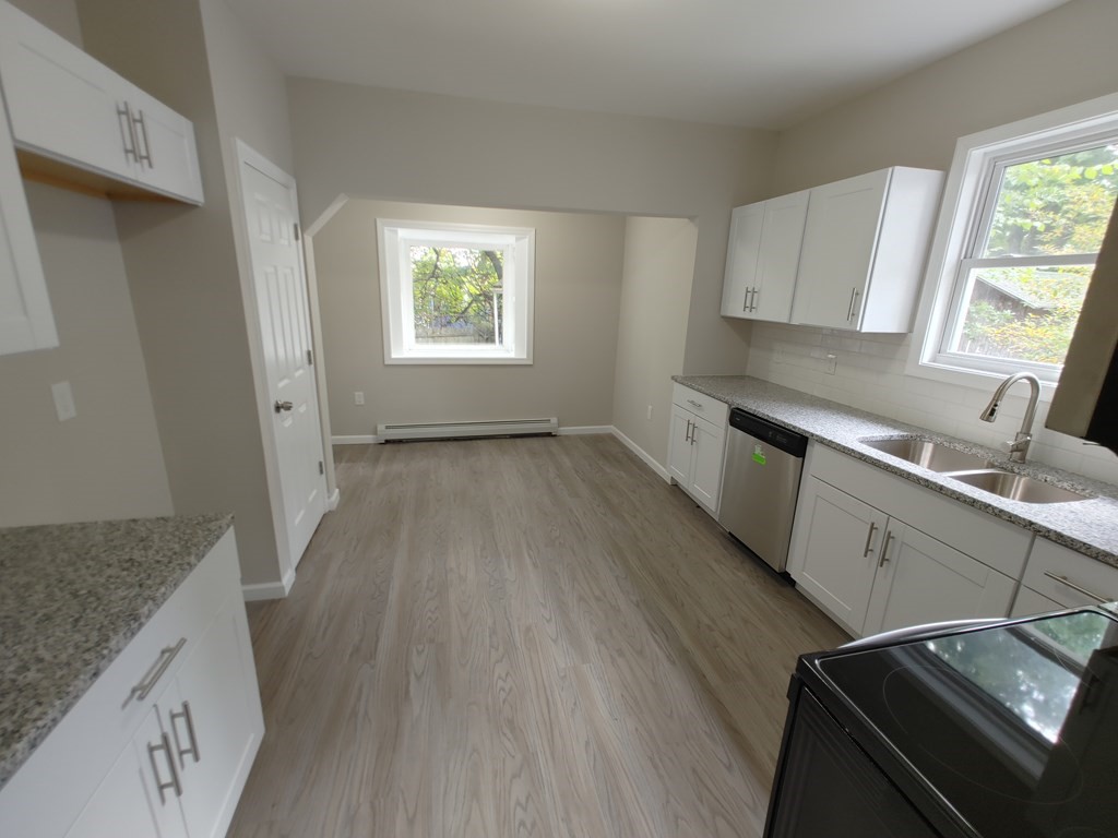 23 Eldert Street Springfield, MA 01109 - Photo 8 of 14 a view of a kitchen sink wooden floor and electronic appliances