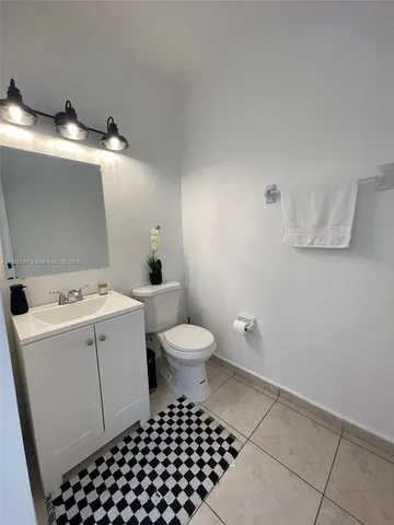 a bathroom with a sink toilet and a tub